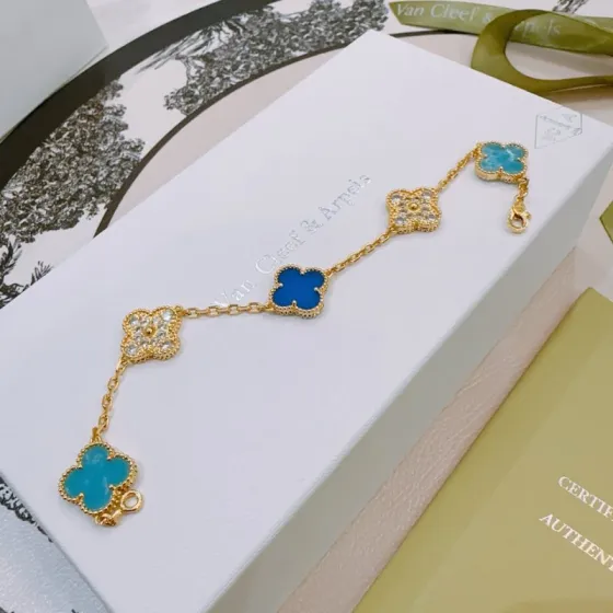 Van Cleef Arpels Alhambra bracelet Yellow gold with turquoise blue royal blue and clear diamond-accented four-leaf clover motifs 17cm