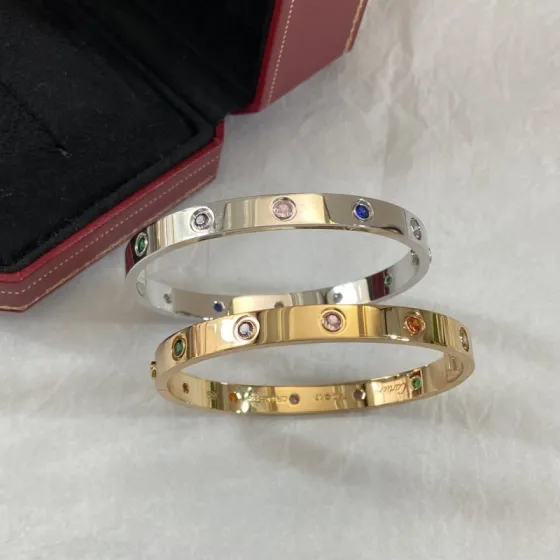 Cartier Love bracelet 18k yellow gold and 18k white gold with multi-color gemstones including pink sapphire blue sapphire green garnet amethyst orange garnet and diamond 17