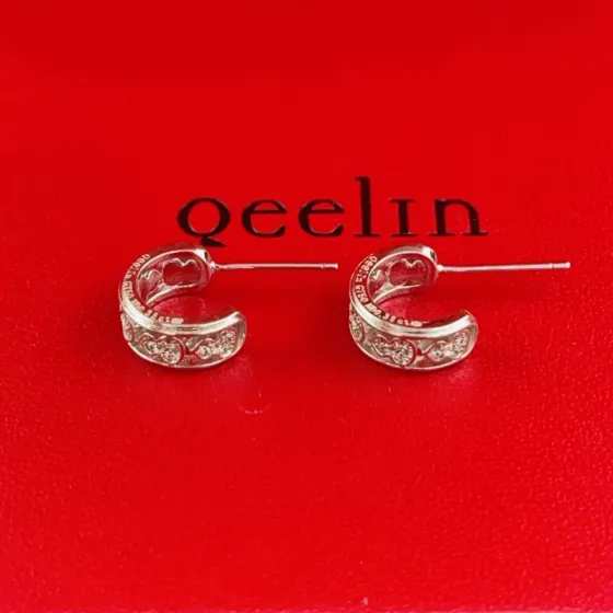 Qeelin Wulu earrings 18K white gold with clear diamond accents 10mm outer diameter