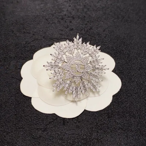 Chanel CC Snowflake Crystal Brooch brooch silver-toned metal with clear crystal accents 4cm diameter