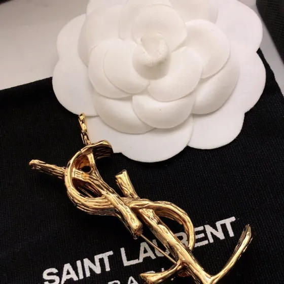 Saint Laurent Cassandre Twisted Monogram Brooch brooch gold tone metal no gemstones 4 5cm height