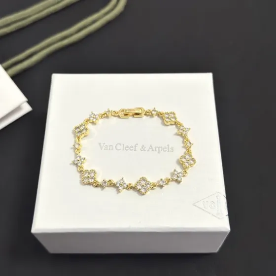 Van Cleef Arpels Alhambra bracelet gold-tone metal with clear diamond-like stones 17cm