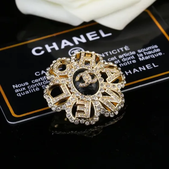 Chanel CC Logo Letter Flower Brooch brooch gold-tone metal clear crystal black enamel 3 5cm diameter