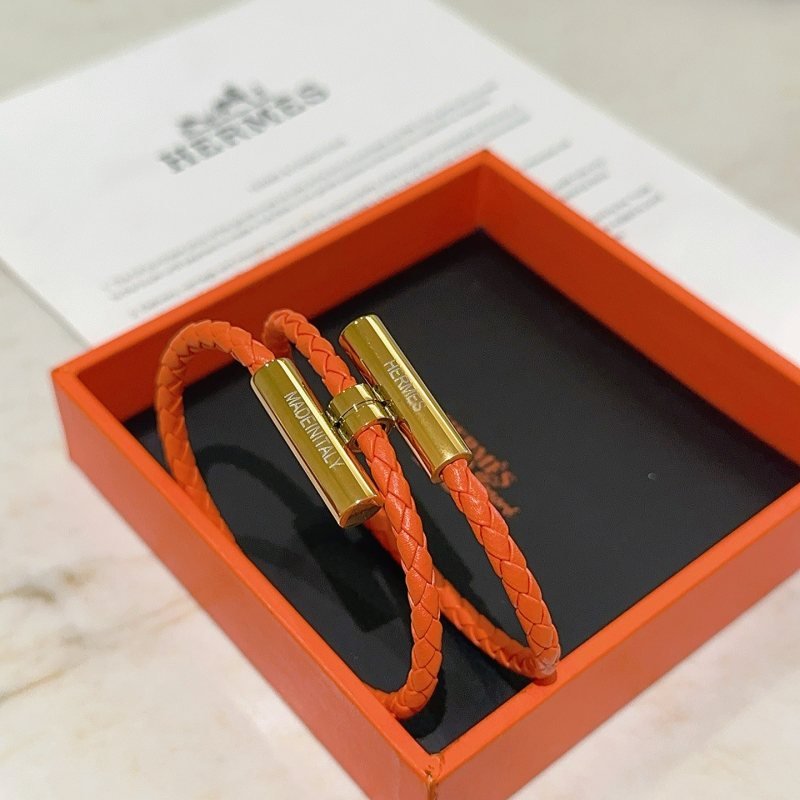Hermes Tournis Tresse bracelet Orange braided leather with gold plated metal hardware 38cm double wrap