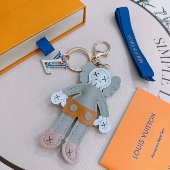 Louis Vuitton Anger Forest KAWS Companion Key Charm pendant Gold-tone metal silver-tone metal blue enamel gray leather white leather tan leather pink leather black stitching 12cm total charm length