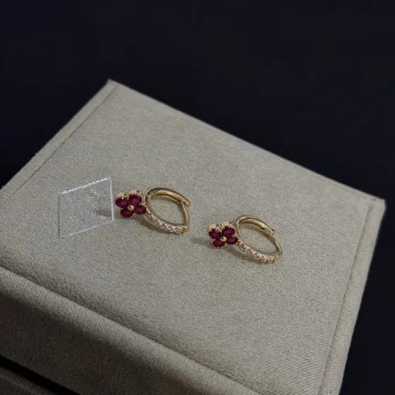 Van Cleef Arpels Alhambra earrings yellow gold metal ruby red clover stones clear diamond accent stones 10mm hoop diameter