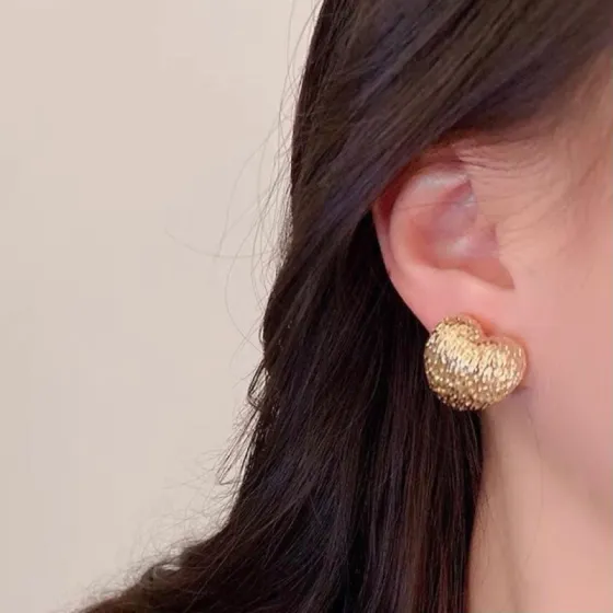 Celine Textured Puffy Heart Stud Earrings earrings Gold-tone metal with textured hammered finish no accent stones 1 5cm stud diameter