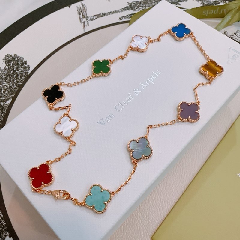 Van Cleef Arpels Alhambra necklace rose gold with multicolor clover inlays red turquoise gray-green purple tiger s eye brown blue light pink mother-of-pearl green malachite black onyx white mother-of-pearl 42cm