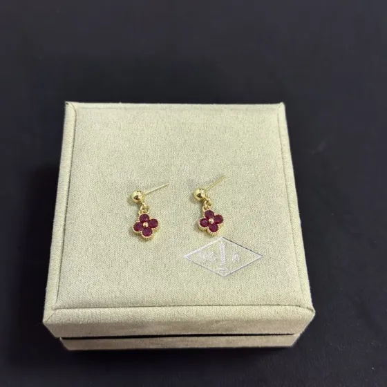 Van Cleef Arpels Alhambra earrings yellow gold metal with deep ruby red gemstones 1 2cm drop length
