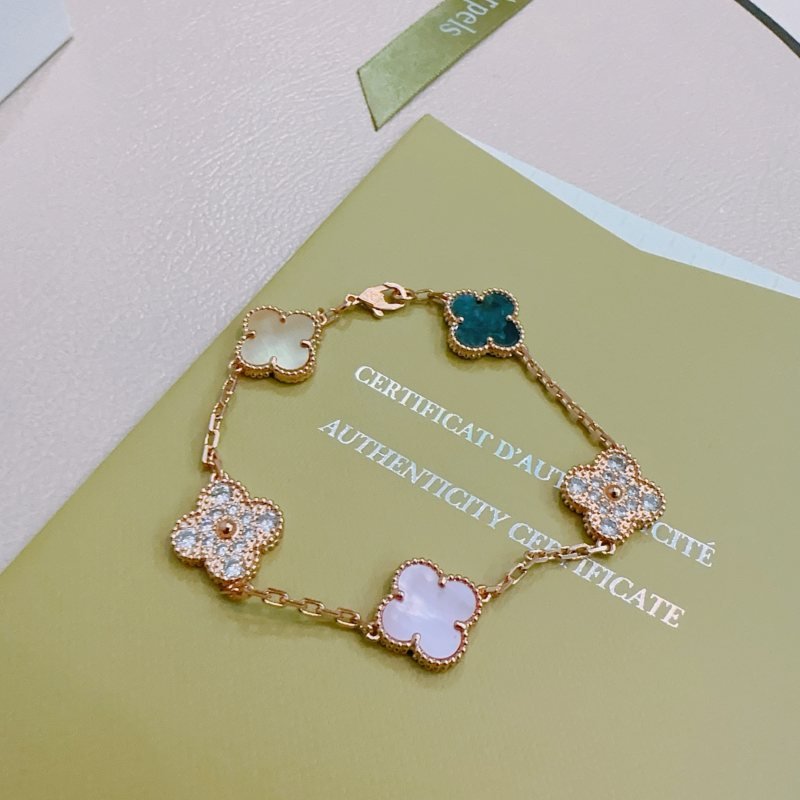 Van Cleef Arpels Alhambra bracelet Rose gold metal with white mother-of-pearl champagne mother-of-pearl teal agate clear diamond accents and iridescent white opal clover motifs 17cm