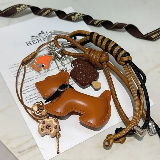 Hermes Buddy Dog Charm Keychain pendant Silver metal tan leather black and tan cord orange enamel brown enamel beige enamel 12cm total length