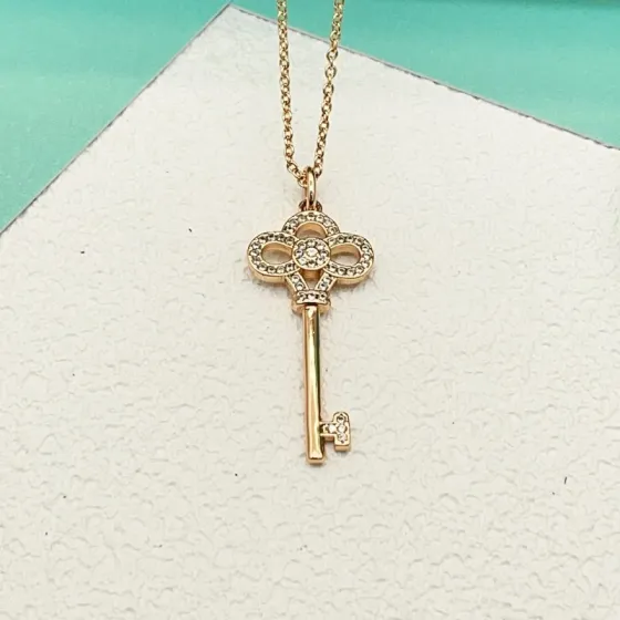 Tiffany Co Tiffany Keys Crown Key Pendant necklace 18k rose gold with clear diamond accents 18 inches