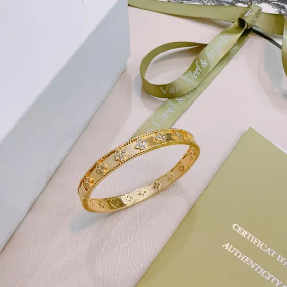 Van Cleef Arpels Perlee Clovers bracelet Yellow gold with diamond accents white gold with diamond accents 17cm