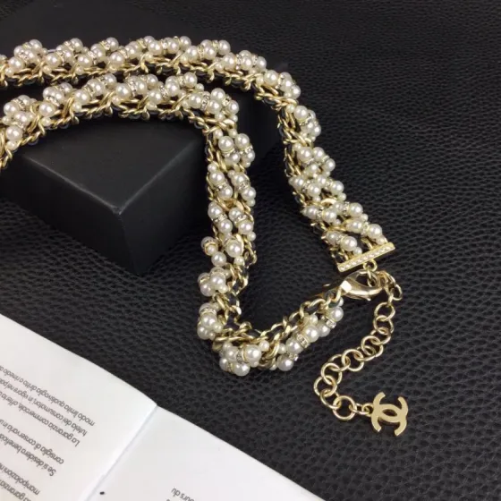 Chanel CC Logo Pearl Chain Medallion necklace gold-tone metal cream white faux pearls clear crystal rhinestones black leather chain accents 42cm with 5cm extender