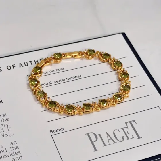 Piaget Rose Vine Gemstone Line Bracelet bracelet Yellow gold metal with olive green peridot and clear diamond accent stones 18cm