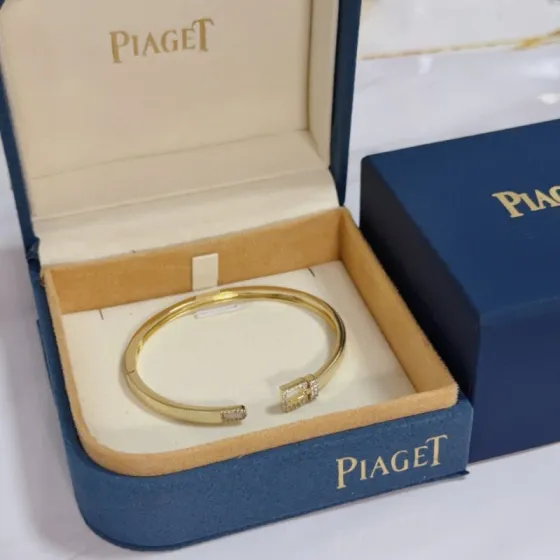Piaget Possession Buckle Cuff bracelet 18k yellow gold with clear diamond accents and white mother-of-pearl inlay 17cm inner circumference