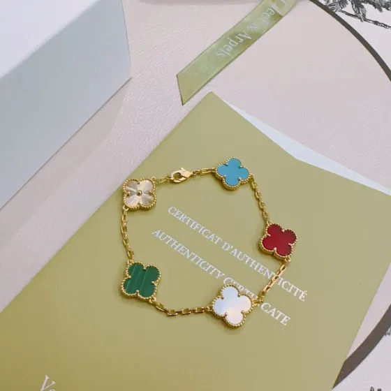 Van Cleef Arpels Alhambra bracelet Yellow gold metal with multi-color stones turquoise blue red carnelian green malachite white mother-of-pearl and gold guilloche clover motifs 18cm
