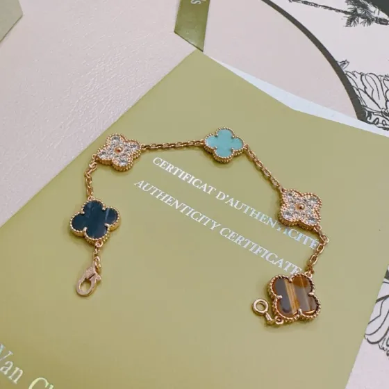 Van Cleef Arpels Alhambra bracelet Rose gold metal with turquoise dark blue stone tiger s eye and clear diamond accents 17cm