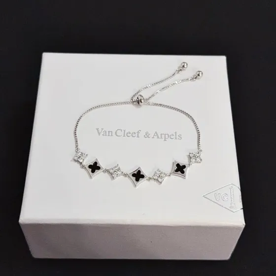 Van Cleef Arpels Alhambra bracelet Silver-toned metal black onyx inlay clear diamond accents Adjustable sliding bolo chain maximum extended length 22cm