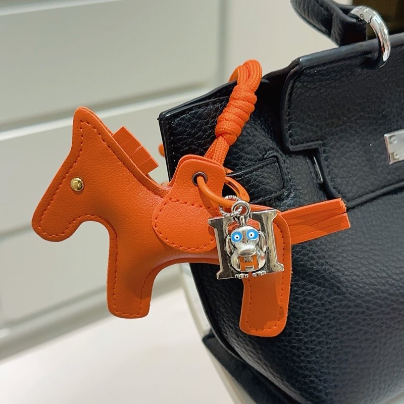 Hermes Rodeo Pegase Horse Charm with H Monkey Pendant pendant Orange leather with silver-tone metal blue and orange enamel accents gold-tone rivet 8cm