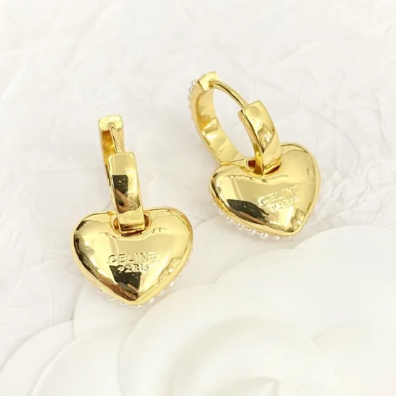 Celine Pearl Heart Charm Huggie Hoop Earrings earrings gold-tone metal with white faux pearl accents 1 5cm hoop diameter 1 2cm heart charm drop