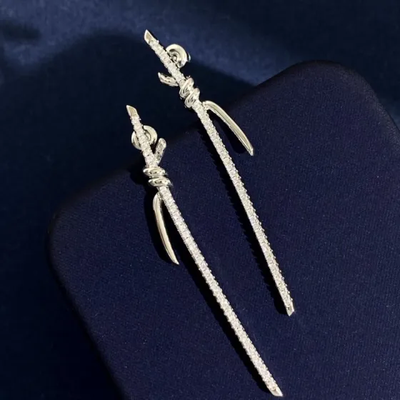 Tiffany Knot earrings available in yellow gold silver rose gold with clear diamond pave 6 5cm length