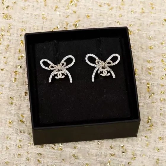 Chanel CC Bow Crystal Stud Earrings earrings silver-toned metal with clear crystal pave light gold-toned bow knot detail 2cm width per earring