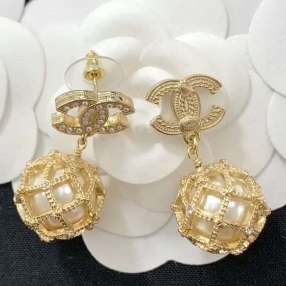 Chanel CC Logo Caged Pearl Drop Earrings earrings Gold-tone metal with cream faux pearls and clear crystal accents Drop length approximately 3cm