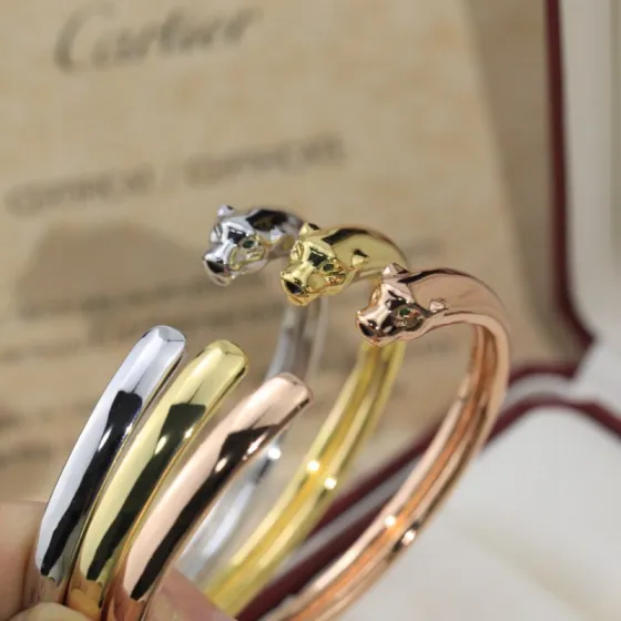 Cartier Panthere de Cartier bracelet 18K white gold 18K yellow gold 18K rose gold green tsavorite garnet eyes black onyx nose accents 17