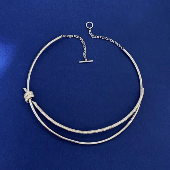 Tiffany Knot necklace silver-toned metal with clear pave stones rose gold-toned metal with clear pave stones yellow gold-toned metal with clear pave stones 16 inches with 2 inch extender