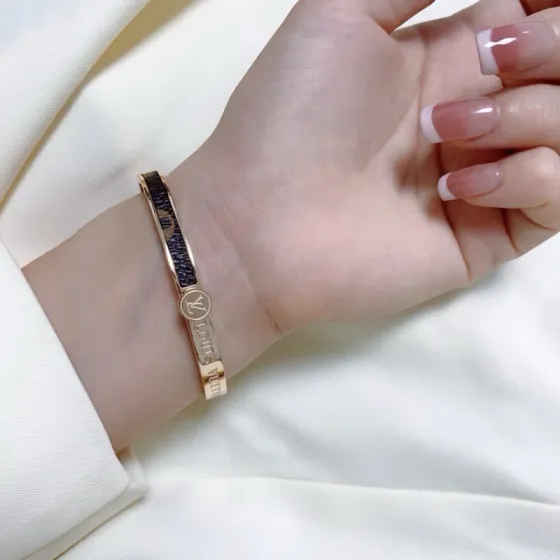 Louis Vuitton LV Circle Monogram Cuff bracelet Rose gold-tone metal with brown monogram coated canvas 17cm