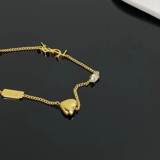 Saint Laurent Cassandre Heart Crystal Charm bracelet gold-tone metal with clear faceted crystal 19cm with 2cm extender