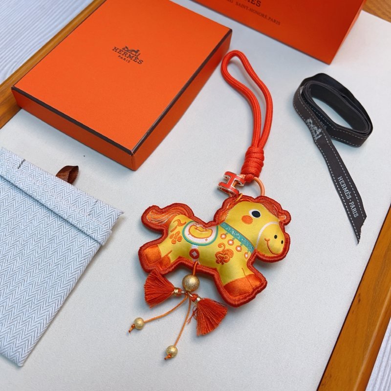 Hermes Year of the Horse Charm Keychain pendant Orange enamel H hardware yellow fabric horse charm with orange embroidery orange cord strap gold tone metal beads orange tassels 12cm strap length