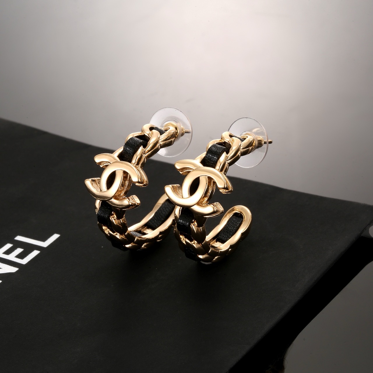 Chanel CC Interlocking Logo Leather Woven Chain Hoop Earrings earrings gold-tone metal with black leather inlay 2 5cm hoop diameter