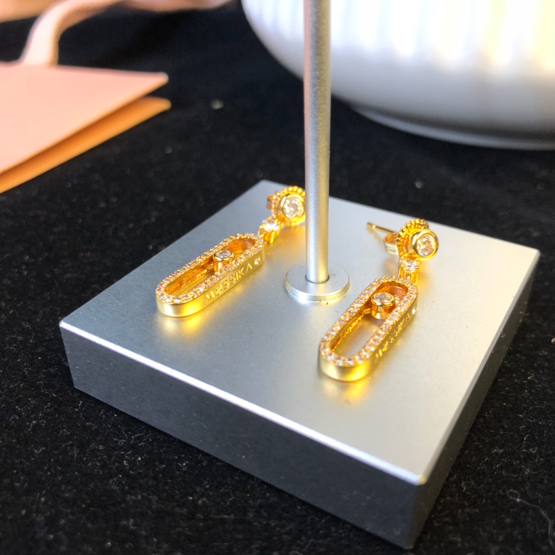 Messika Move Uno earrings Available in 18k rose gold 18k yellow gold and 18k white gold all set with clear round brilliant diamonds 2 5cm drop length