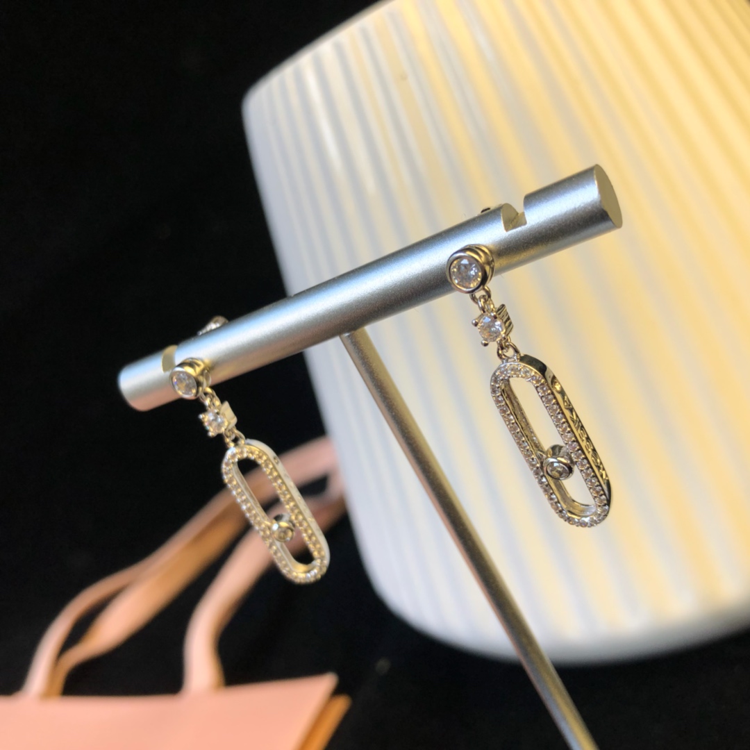 Messika Move Uno earrings Available in 18k rose gold 18k yellow gold and 18k white gold all set with clear round brilliant diamonds 2 5cm drop length