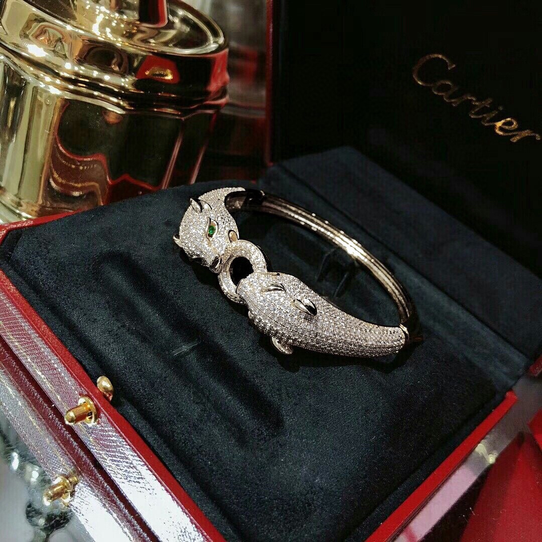 Cartier Panthere de Cartier bracelet 18K white gold pave set diamonds emerald green panther eyes black onyx accents 17cm
