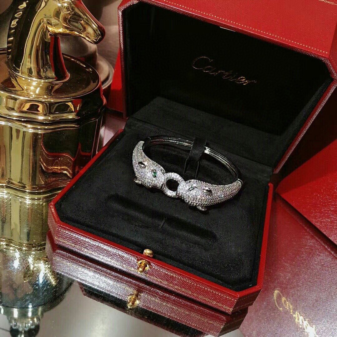Cartier Panthere de Cartier bracelet 18K white gold pave set diamonds emerald green panther eyes black onyx accents 17cm