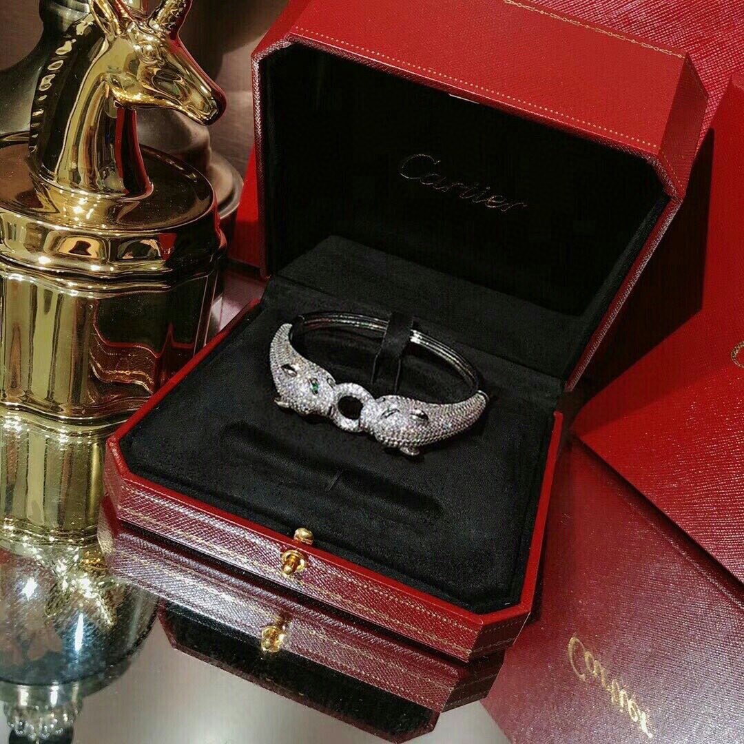 Cartier Panthere de Cartier bracelet 18K white gold pave set diamonds emerald green panther eyes black onyx accents 17cm