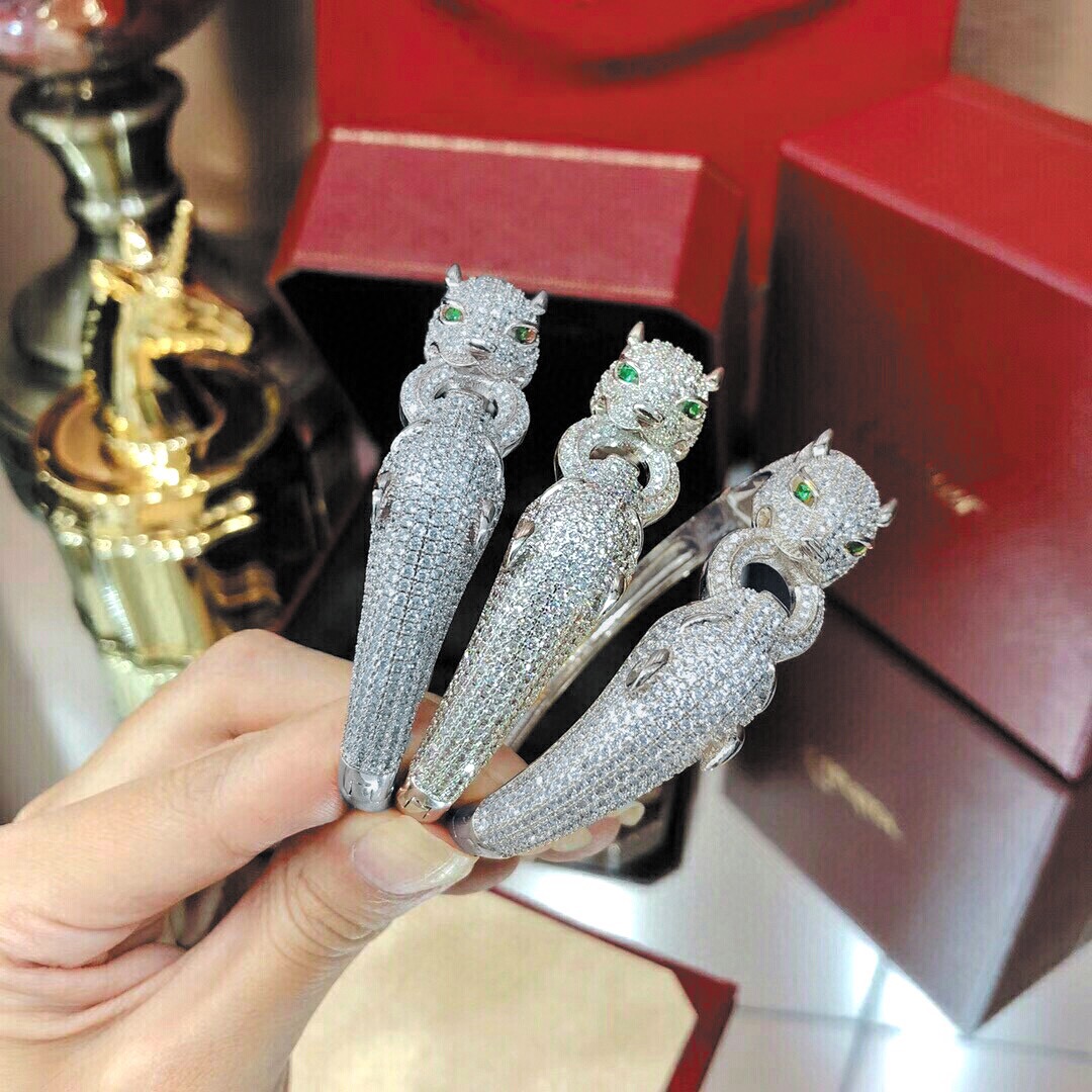 Cartier Panthere de Cartier bracelet 18K white gold pave set diamonds emerald green panther eyes black onyx accents 17cm