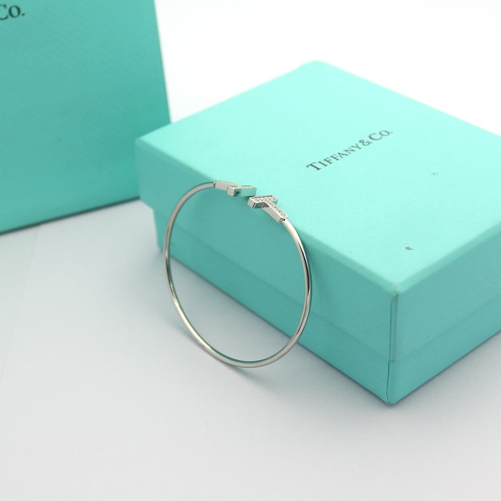 Tiffany Tiffany T bracelet Available in 18k rose gold 18k yellow gold and sterling silver all set with clear round brilliant diamonds 17cm inner circumference