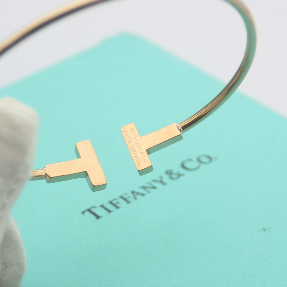 Tiffany Tiffany T bracelet Available in 18k rose gold 18k yellow gold and sterling silver all set with clear round brilliant diamonds 17cm inner circumference