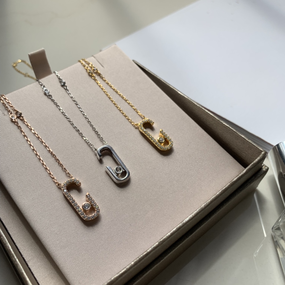 Messika Gigi Hadid Move Addiction Safety Pin Pendant Necklace necklace Available in 18k yellow gold 18k rose gold 18k white gold with pave set clear diamonds and a central moving diamond 42cm adjustable chain