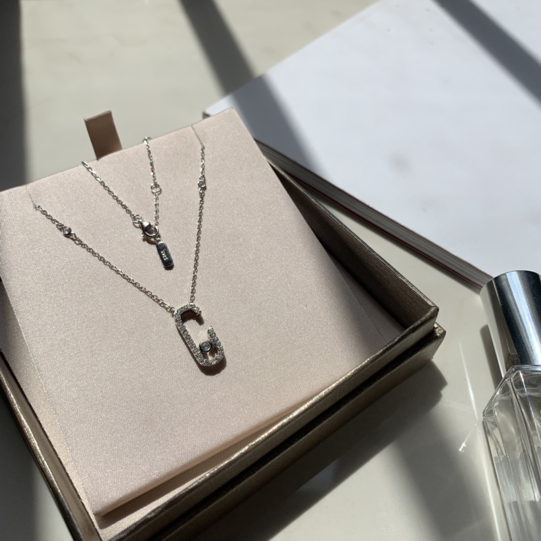 Messika Gigi Hadid Move Addiction Safety Pin Pendant Necklace necklace Available in 18k yellow gold 18k rose gold 18k white gold with pave set clear diamonds and a central moving diamond 42cm adjustable chain