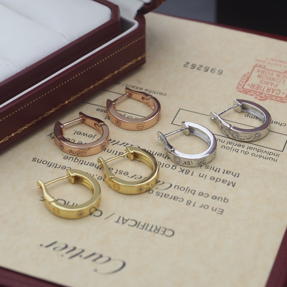 Cartier Love earrings Available in 18k rose gold 18k yellow gold and 18k white gold each set with small clear round diamonds 13mm outer hoop diameter