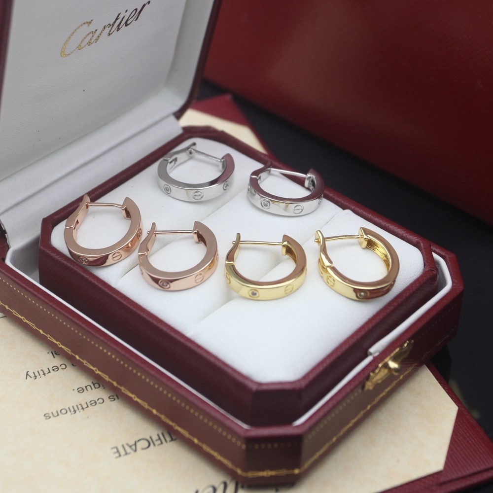 Cartier Love earrings Available in 18k rose gold 18k yellow gold and 18k white gold each set with small clear round diamonds 13mm outer hoop diameter