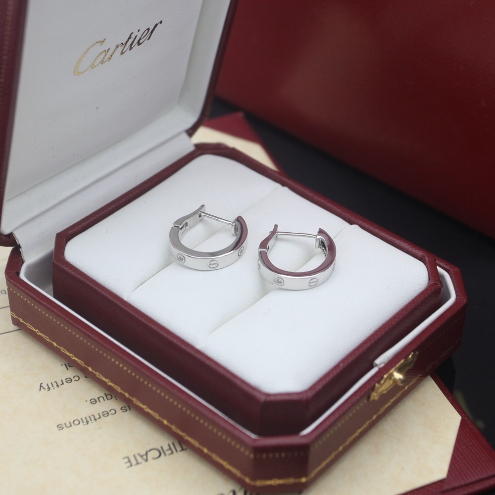 Cartier Love earrings Available in 18k rose gold 18k yellow gold and 18k white gold each set with small clear round diamonds 13mm outer hoop diameter
