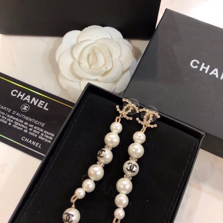 Chanel CC Logo Graduated Pearl Drop Earrings earrings Gold-tone metal white faux pearl clear crystal black enamel CC logo 6 5cm drop length
