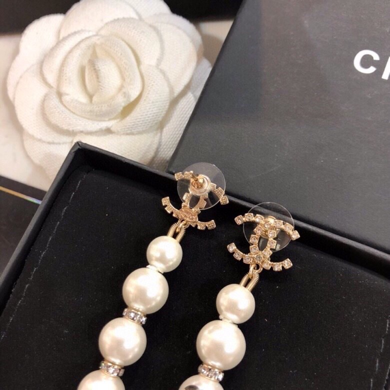 Chanel CC Logo Graduated Pearl Drop Earrings earrings Gold-tone metal white faux pearl clear crystal black enamel CC logo 6 5cm drop length