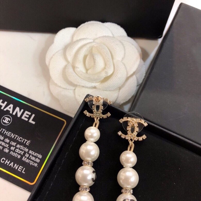 Chanel CC Logo Graduated Pearl Drop Earrings earrings Gold-tone metal white faux pearl clear crystal black enamel CC logo 6 5cm drop length